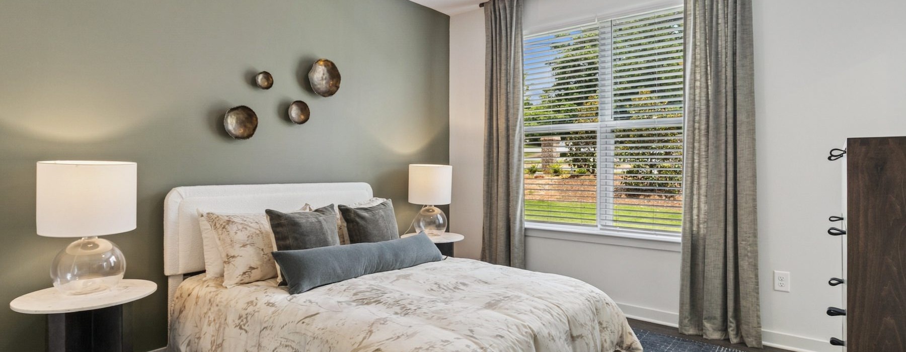 a bedroom with a large window