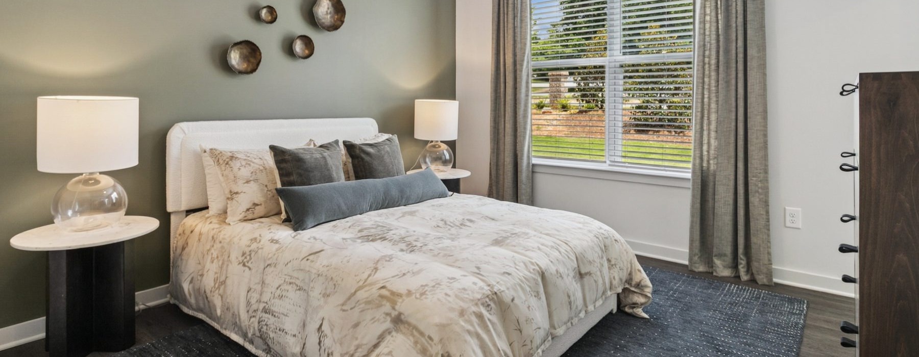a bedroom with a large window