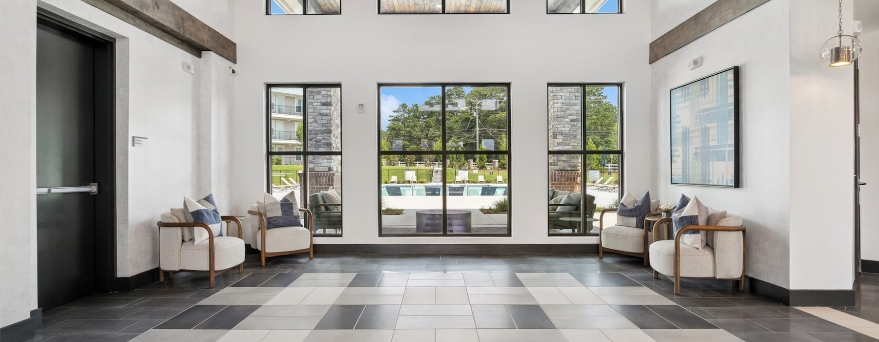 a room with a large window and a large tile floor