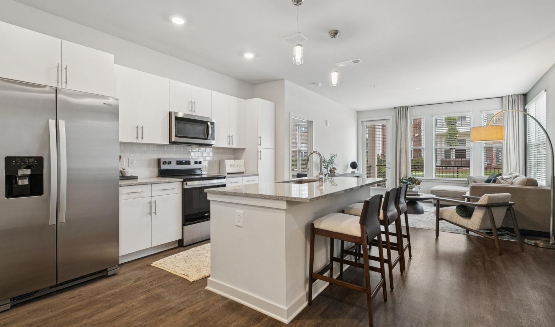Spacious kitchens with thoughtful details a kitchen with white cabinets