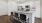 a kitchen with white cabinets